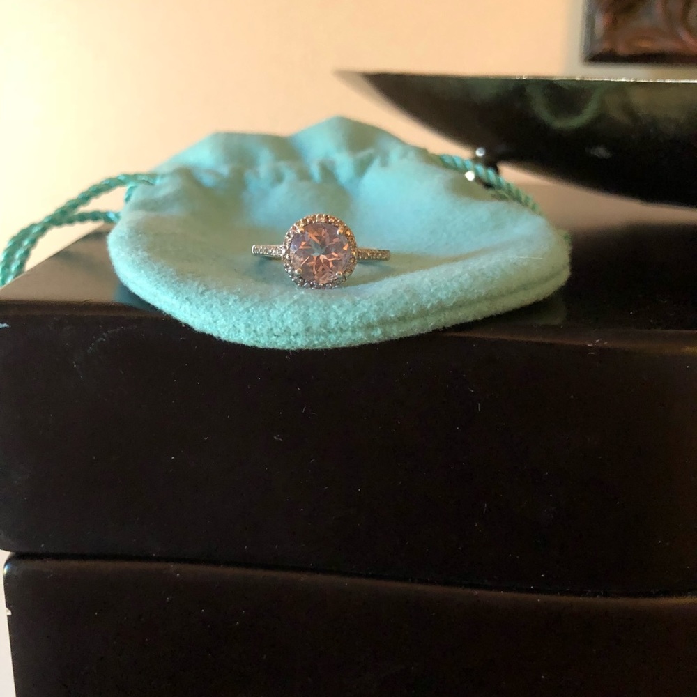 Purple topaz stone. Diamonds around